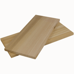 Two cedar grilling planks for adding smoky flavor to grilled foods.