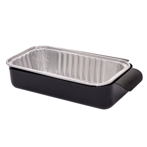 Black ceramic roasting pan with aluminum foil insert.