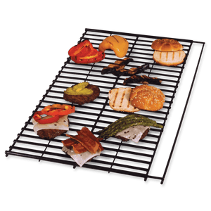 Black grill grate with assorted grilled foods: vegetables, bread, and meats.