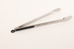 Silver tongs with "CB" and "Char-Broil" branding, white grip ends.