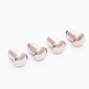 Silver dome-shaped metal fasteners, four pieces.