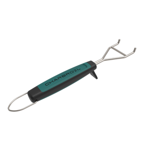 Teal and black Char-Broil grill cleaning tool with metal prongs.