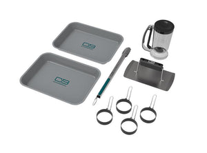 Gray Char-Broil portable cookware set with trays, tongs, and pot stand.