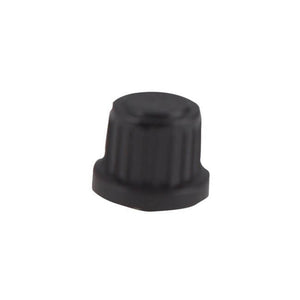 Black plastic valve cap with ridged sides, used for sealing tire valves. Compact and lightweight design.