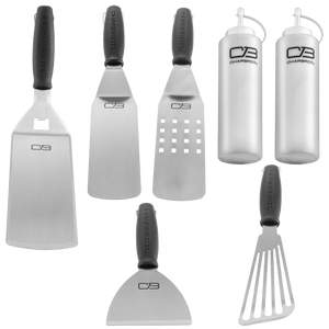 White Char-Broil kitchen tools set with spatulas, tongs, and basting bottles.