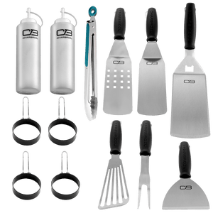 White and black Char-Broil cooking tools set with tongs, spatulas, and egg rings.